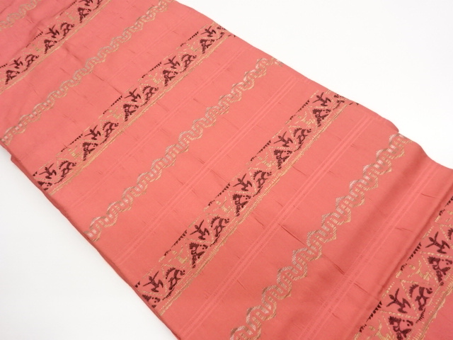 横段に抽象人物・幾何学模様織出し名古屋帯